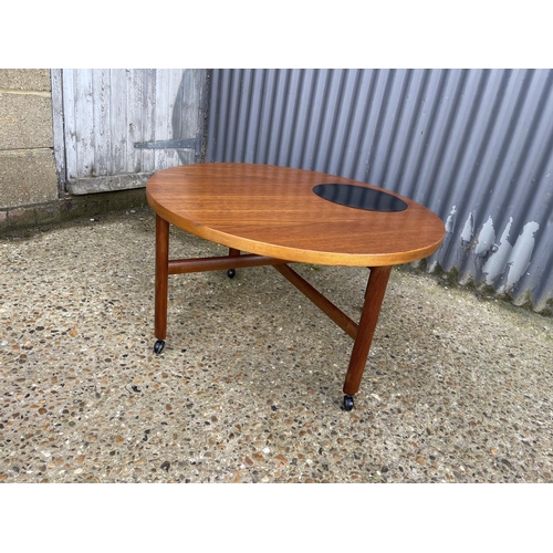 60 - A danish design teak coffee table with cross stretcher base. Unmarked but similar to France & Sons