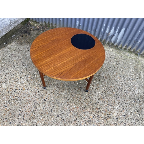 60 - A danish design teak coffee table with cross stretcher base. Unmarked but similar to France & Sons