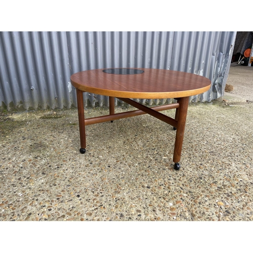 60 - A danish design teak coffee table with cross stretcher base. Unmarked but similar to France & Sons