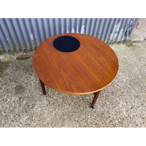 60 - A danish design teak coffee table with cross stretcher base. Unmarked but similar to France & Sons