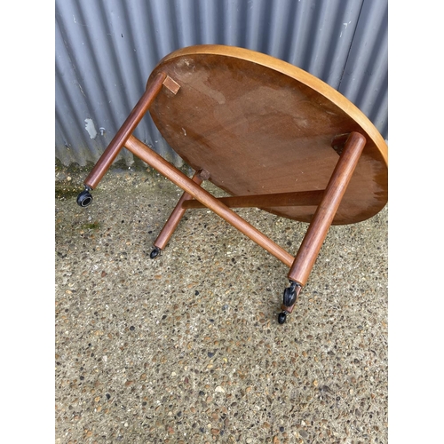 60 - A danish design teak coffee table with cross stretcher base. Unmarked but similar to France & Sons