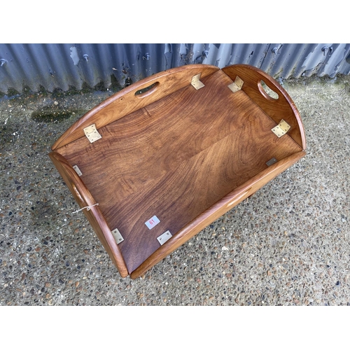 61 - A reproduction mahogany butlers tray top table