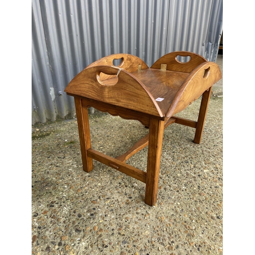 61 - A reproduction mahogany butlers tray top table