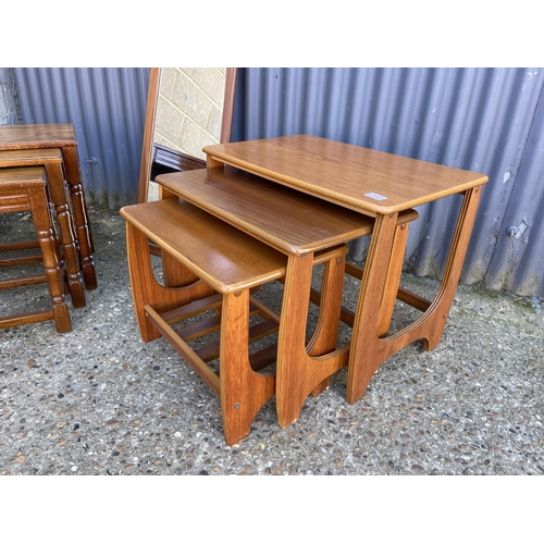 82 - A retro nest of tables, retro mirror and oak nest of three