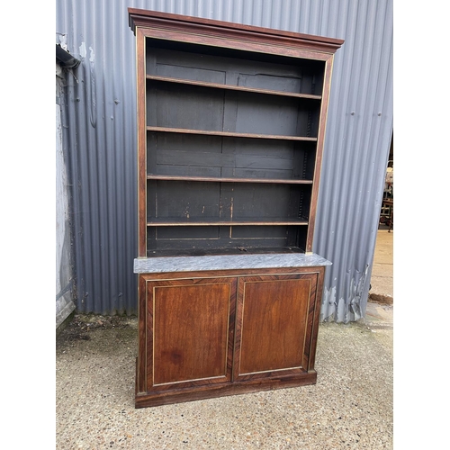 84 - A french empire mahogany bookcase cupboard  with  brass beading and a grey marble surface 126x45 x23... 