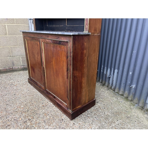 84 - A french empire mahogany bookcase cupboard  with  brass beading and a grey marble surface 126x45 x23... 