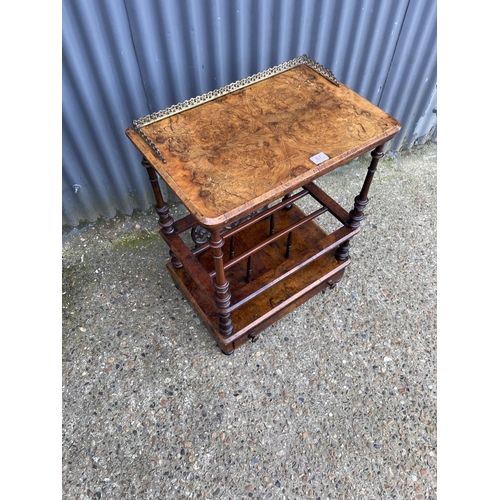 87 - A Victorian walnut inlaid canterbury with a brass gallery back and single drawer