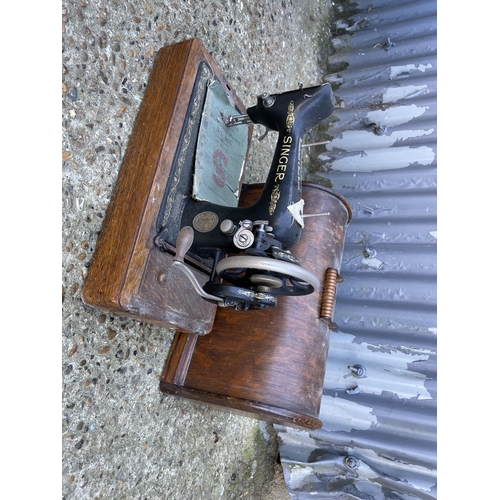 9 - An oak cased singer sewing machine