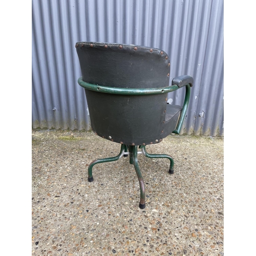 95 - A vintage green metal framed machinists swivel chair