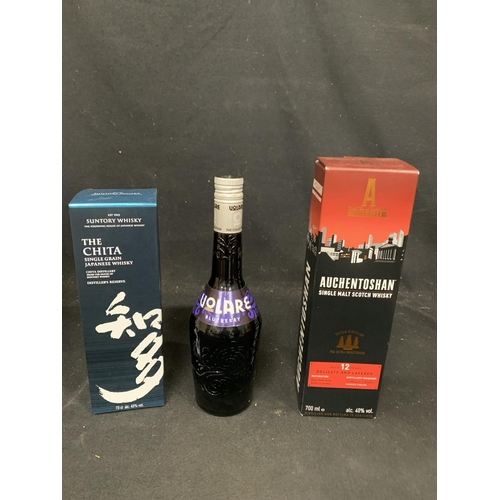 1074 - Two Boxed bottles of Whisky and bottle of Blueberry Liquor