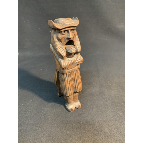 524 - Carved wooden nutcracker in form of an old man height 21 cms