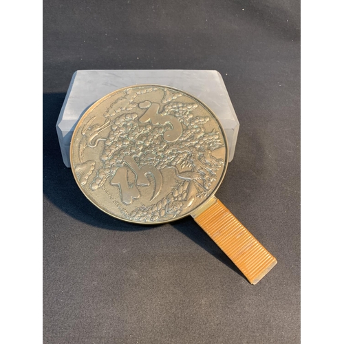 525 - Chinese white metal hand mirror,  18 cms diameter