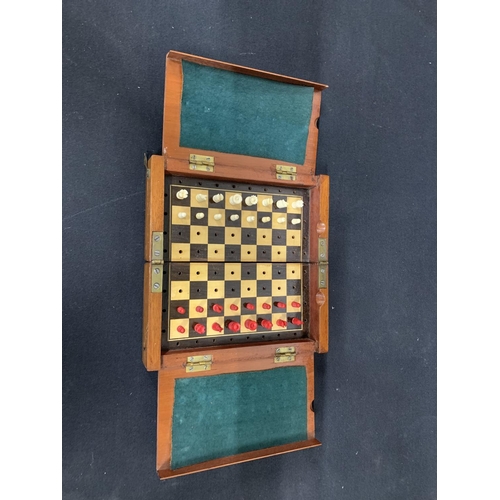 538 - Folding Mahogany travelling chess set, board size 20 x 20 cms when open