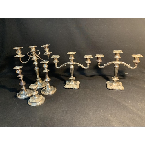 581 - Pair of silver plated candelabra plus one other and three candlesticks