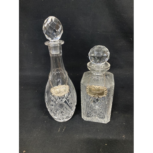 590 - Two cut glass Decanters each with Hallmarked Silver labels Gin and Whisky