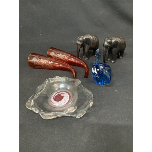 683 - Two wooden elephants and one blue glass elephant, pair of vintage red crystal glass hunter horns & g... 