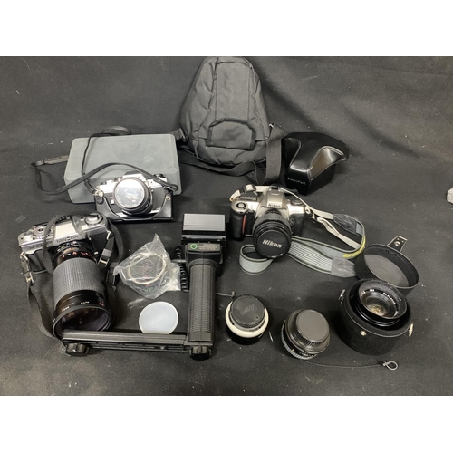 692 - SLR Camera and Lens, Nikon F65 Camera & AF Nikkor 28-80 mm Lens, Olympus OM10 & Zuiko 50 mm F1.8mm L... 