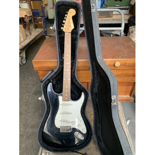 705 - Fender style electric guitar in hard case