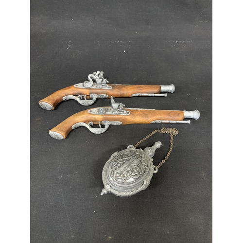 756 - Pair of replica Flintlock Pistols with powder flask