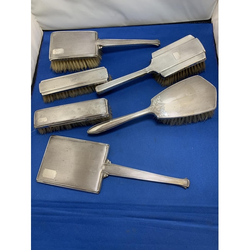 872 - Five Hallmarked Silver dressing table brushes and hand mirror