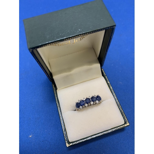 888 - Hallmarked 9ct Gold Dress Ring with five large blue stones, size O, weight 2.7 gms