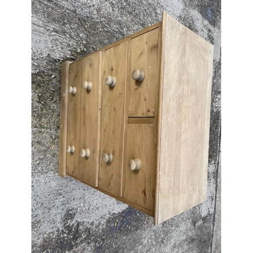 100 - A solid pine chest of five drawers