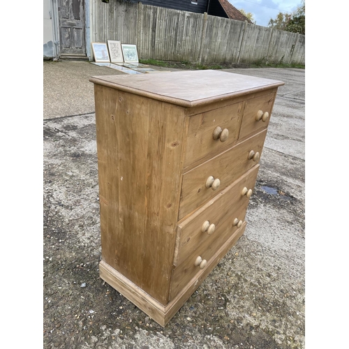 100 - A solid pine chest of five drawers