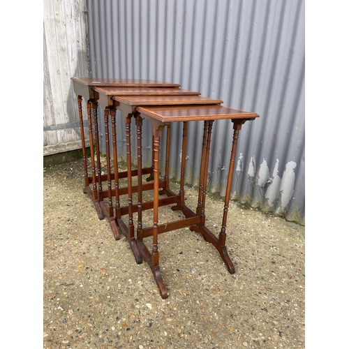 107 - An Edwardian mahogany inkaid nest of four tables