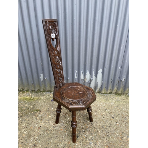 108 - A carved oak spinning chair