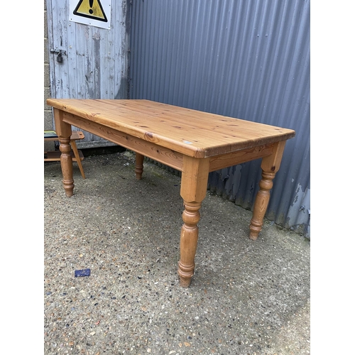 128 - A rectangular pine kitchen table