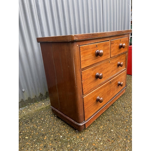 13 - A Victorian mahogany chest of four drawers