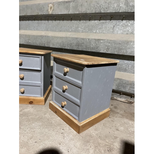 133 - A pair of grey painted pine bedside chests of three drawers