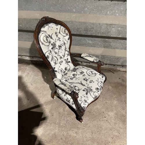 134 - A victorian mahogany spoon back chair with white and black pattern upholstery