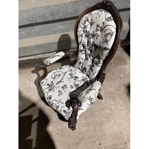 134 - A victorian mahogany spoon back chair with white and black pattern upholstery