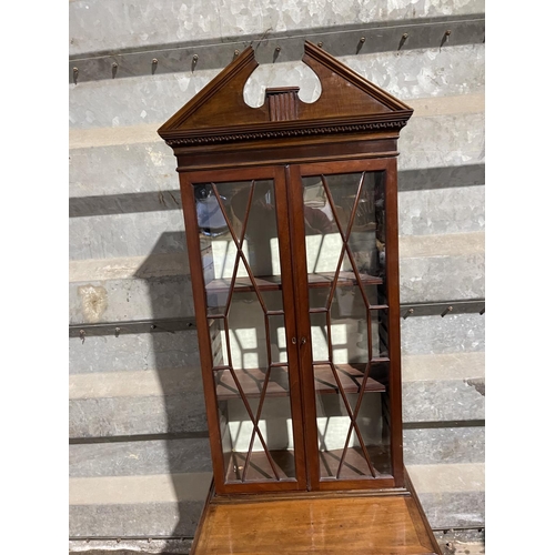 137 - A victorian and later mahogany bookcase cupbaord