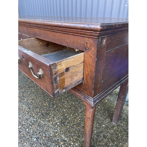 138 - An early oak three drawer dresser base