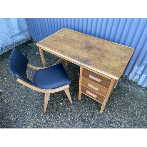 152 - A mid century oak writing desk together with a black vinyl BENCHAIR office chair