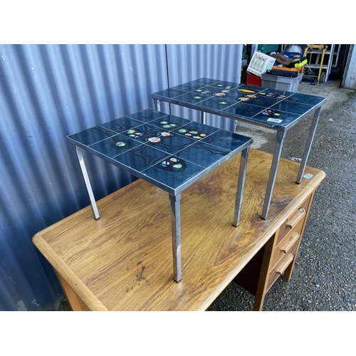 154 - A mid century tile top chrome nest of two tables