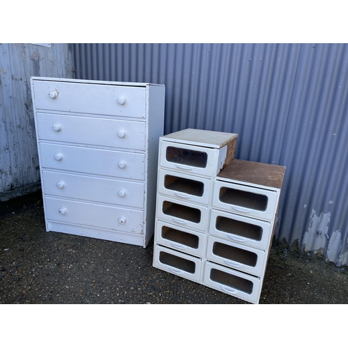 162 - A white painted bank of shop drawers together with another white painted chest