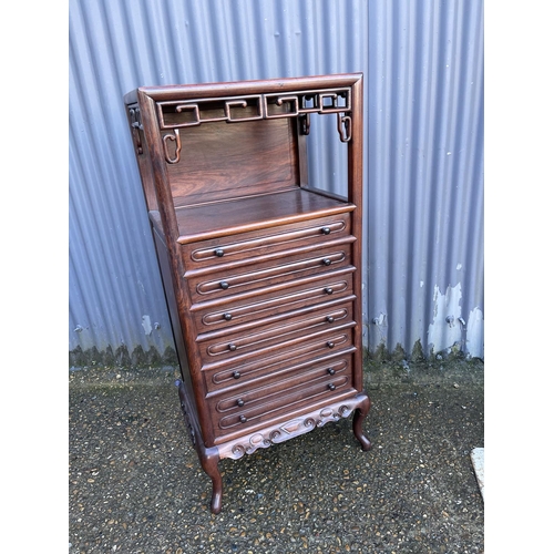 163 - An oriental hardwood six drawer music cabinet. / chest