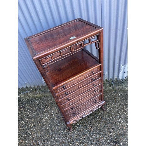 163 - An oriental hardwood six drawer music cabinet. / chest