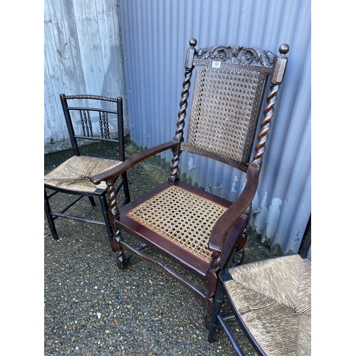 169 - A begere carver chair together with two rush seat chairs