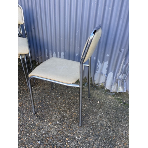 183 - A set of four vinyl and chrome stacking kitchen chairs