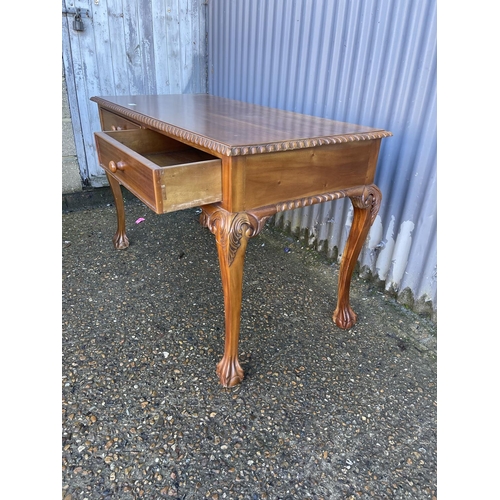 191 - A reproduction mahogany two drawer writing table