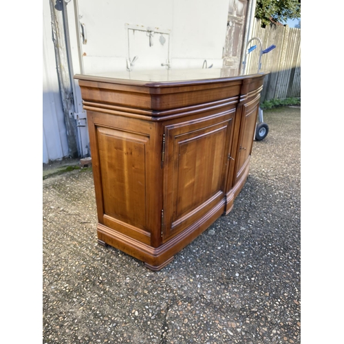 195 - A large reproduction mahogany bow front sideboard with two drawers and two cupboard doors