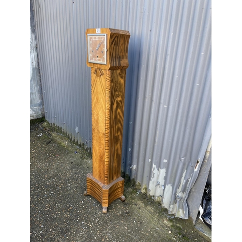 215 - A walnut cased grandmother clock