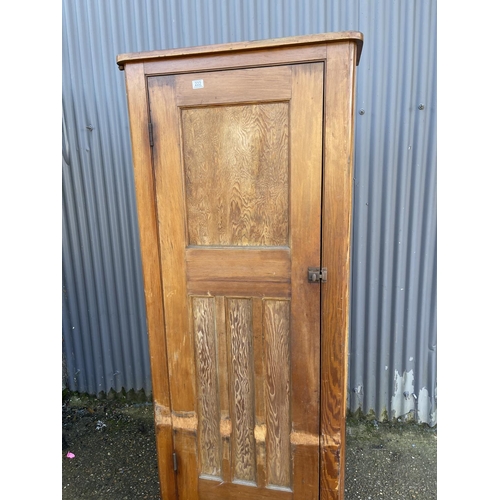 222 - A tall vintage pine larder cupboard with shelves to the interior