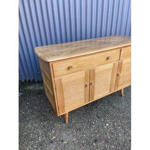 229 - A mid century light elm Ercol sideboard