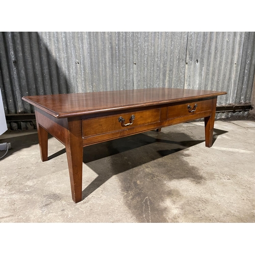 23 - A large mahogany two drawer coffee table
