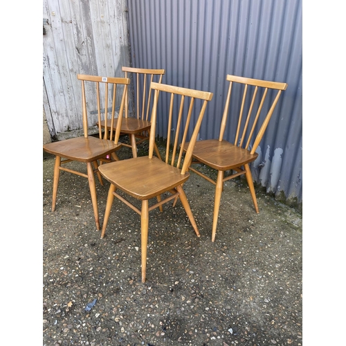 230 - A set of four light elm Ercol dining chairs